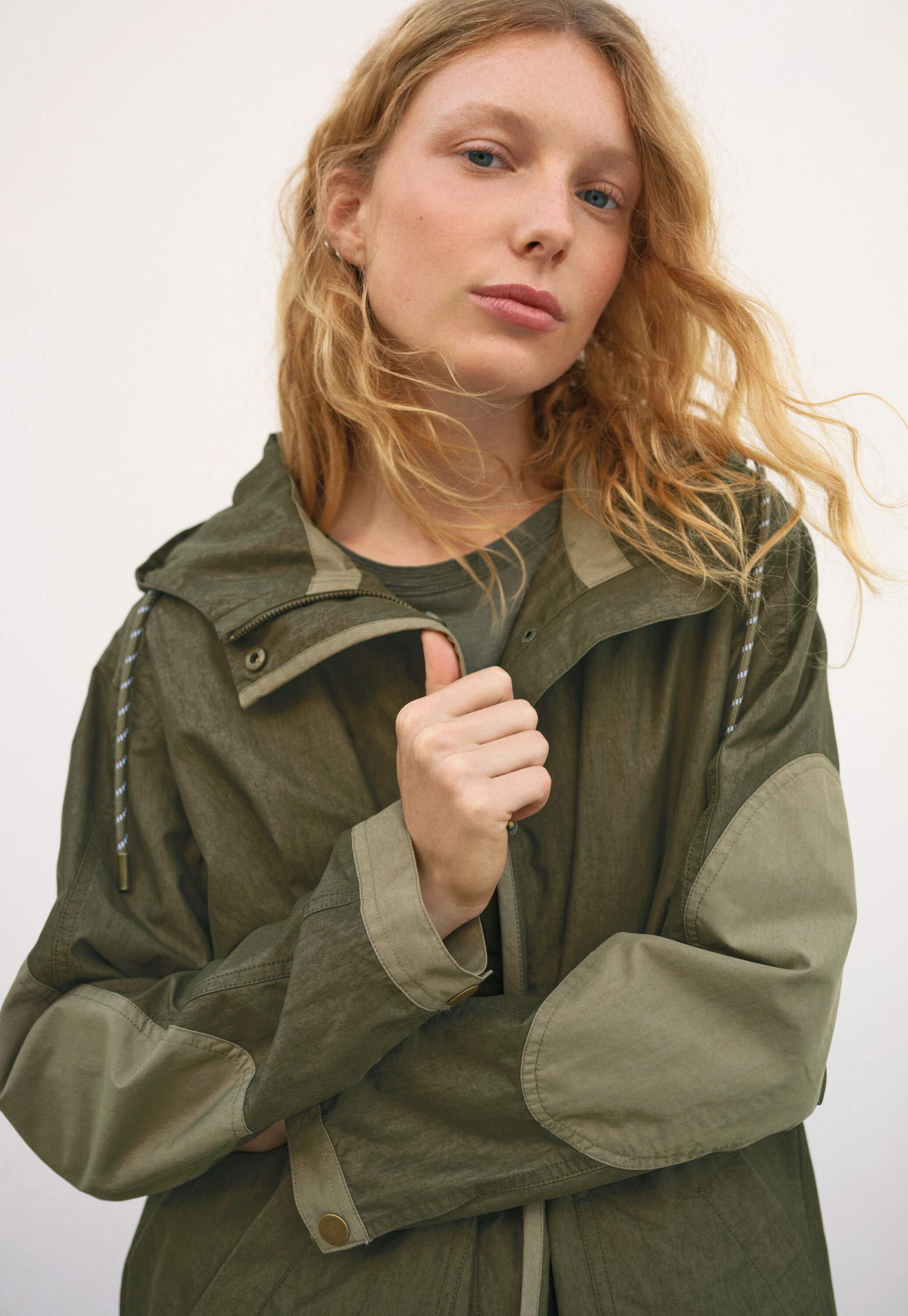 Regenparka mit Eins&auml;tzen